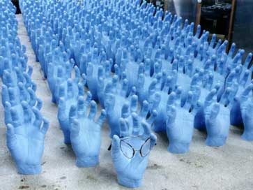 Model hands holding Flexi Specs for shop window displays